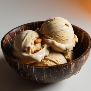 Cashew Butter Honey Almond Nice Cream In A Coconut Bowl