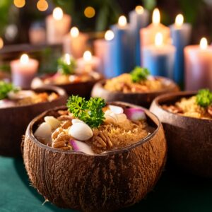 Firefly Coconut Bowls Filled With Food And Candles At A Party 55398