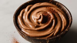 Nut Butter Chocolate Smoothie In A Coconut Bowl