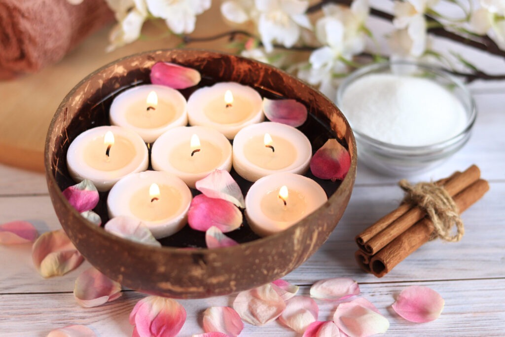 Burning Candles In Water. Spa Composition. Coconut Bowl With Can