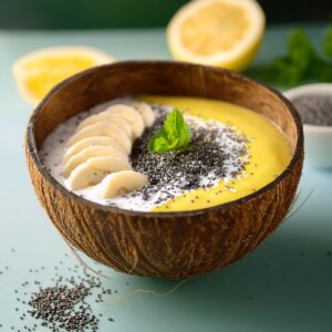 Lemon Poppy Seed Smoothie Bowl Served In A Coconut Shell Bowl