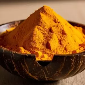 Turmeric Powder In A Coconut Bowl